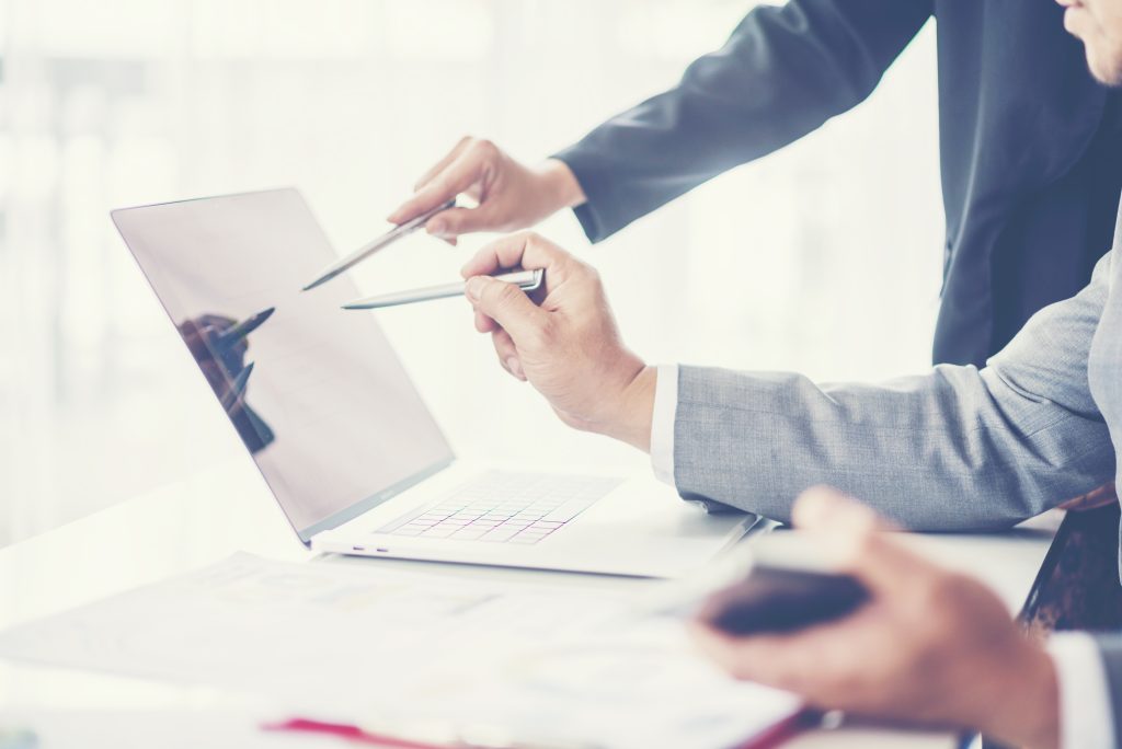 Business adviser analyzing financial figures denoting the progress in the work of the company